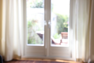 Blurred view of glass door at home