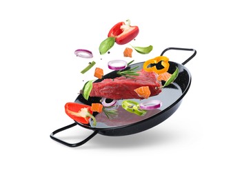 Image of Tasty fresh ingredients and pan on white background