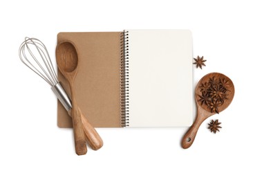 Photo of Blank recipe book, anise stars and kitchen utensils on white background, top view. Space for text