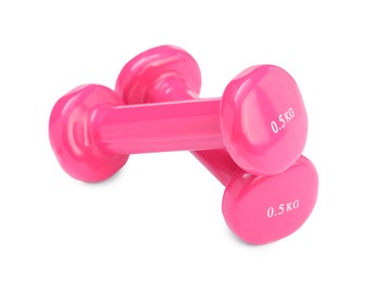 Pink dumbbells isolated on white. Sports equipment