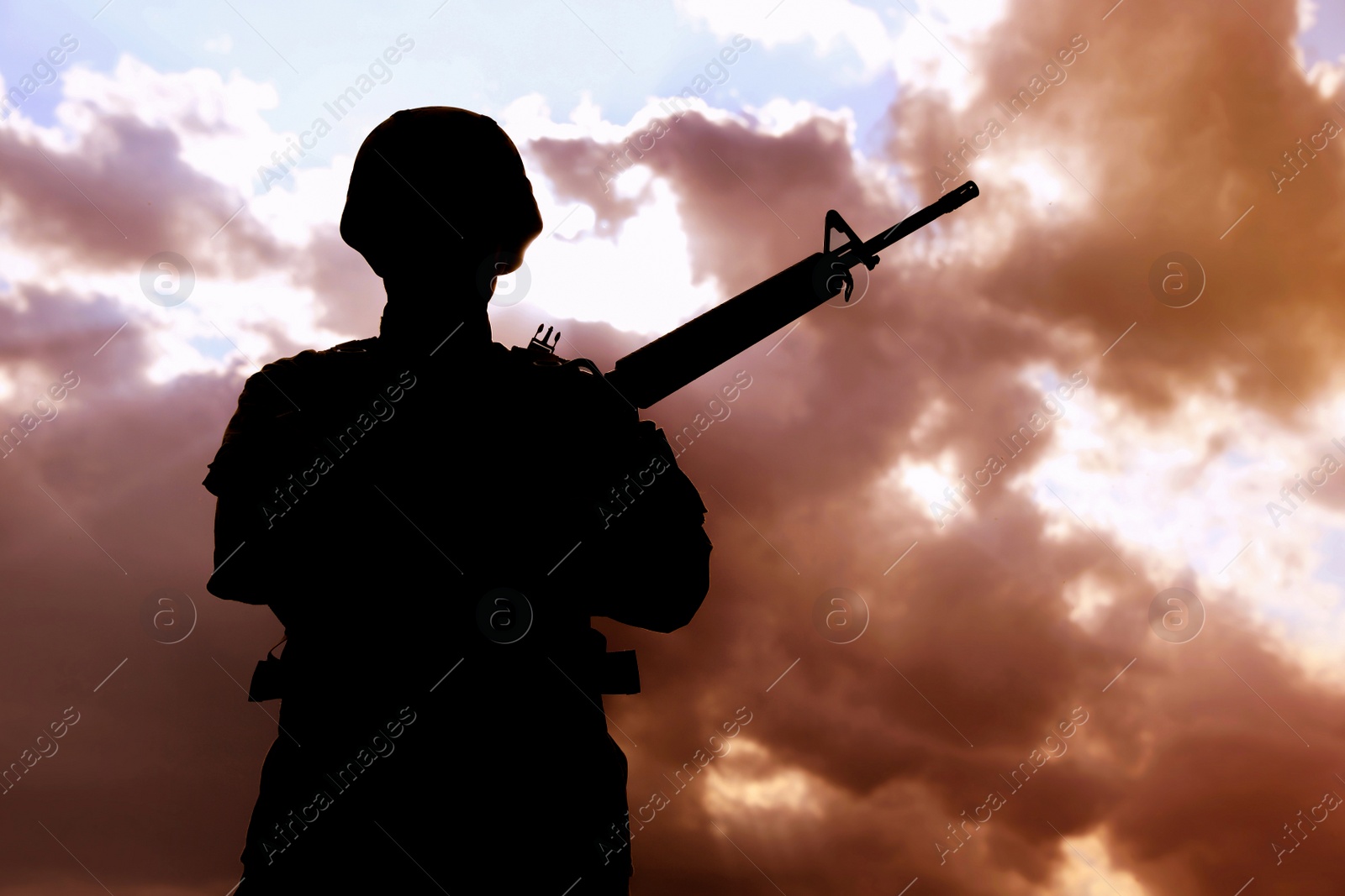 Photo of Soldier with machine gun patrolling outdoors. Military service