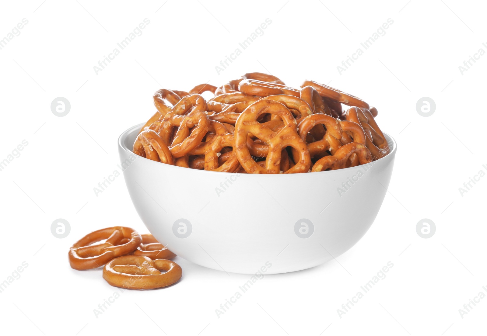 Photo of Delicious pretzel crackers in bowl isolated on white