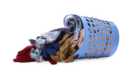 Overturned laundry basket full of clothes isolated on white