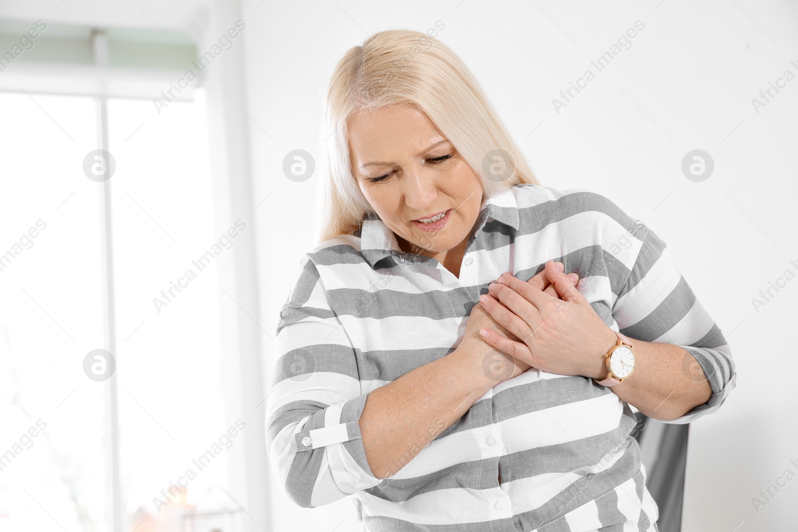 Photo of Mature woman having heart attack at home