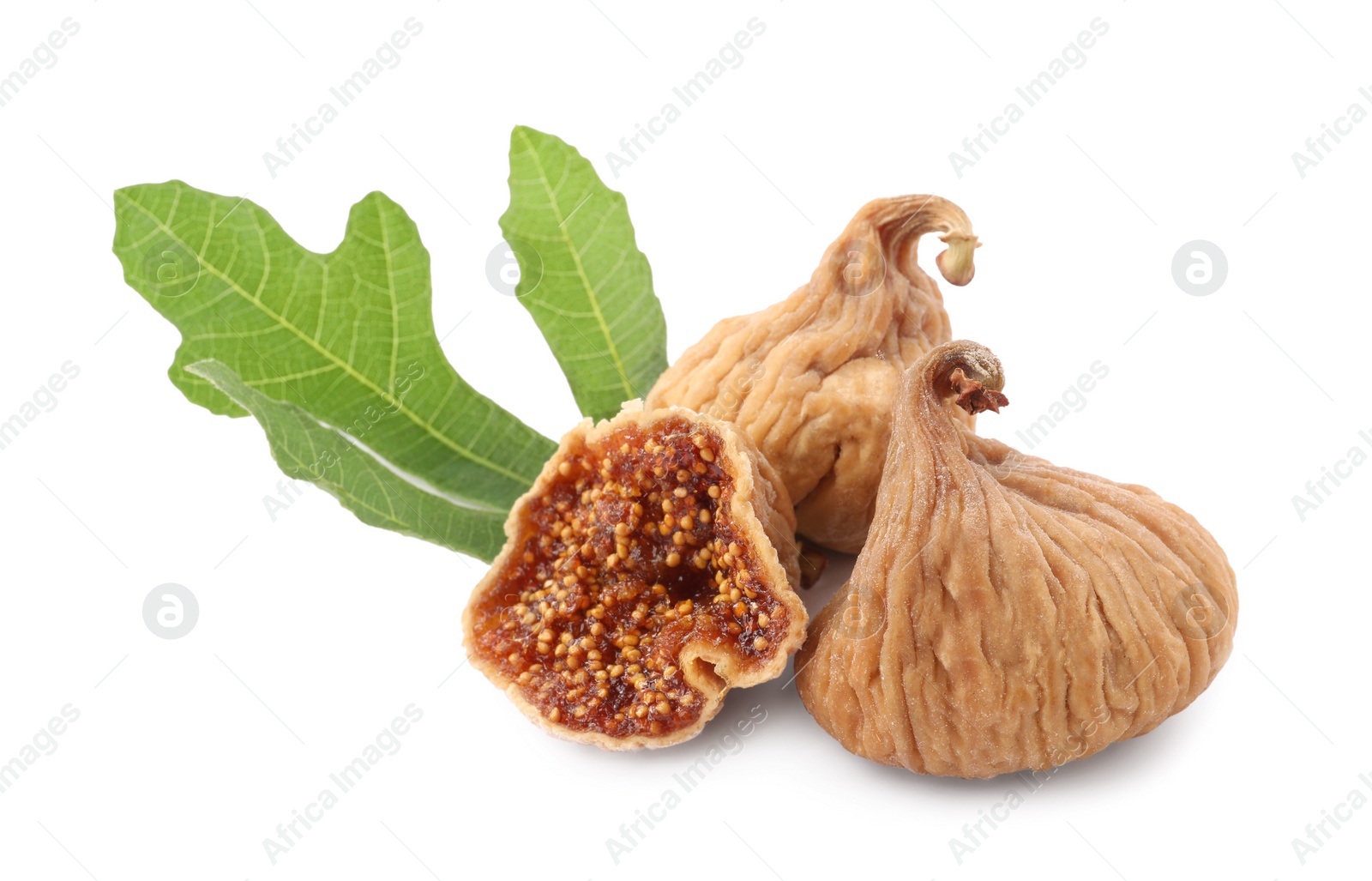 Photo of Tasty dried figs and green leaf isolated on white