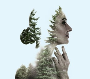 Image of Double exposure of beautiful woman and conifer forest