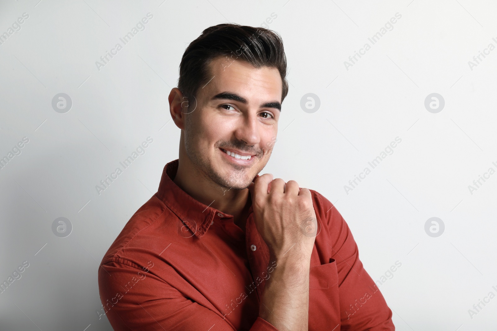 Photo of Portrait of handsome young man on white background