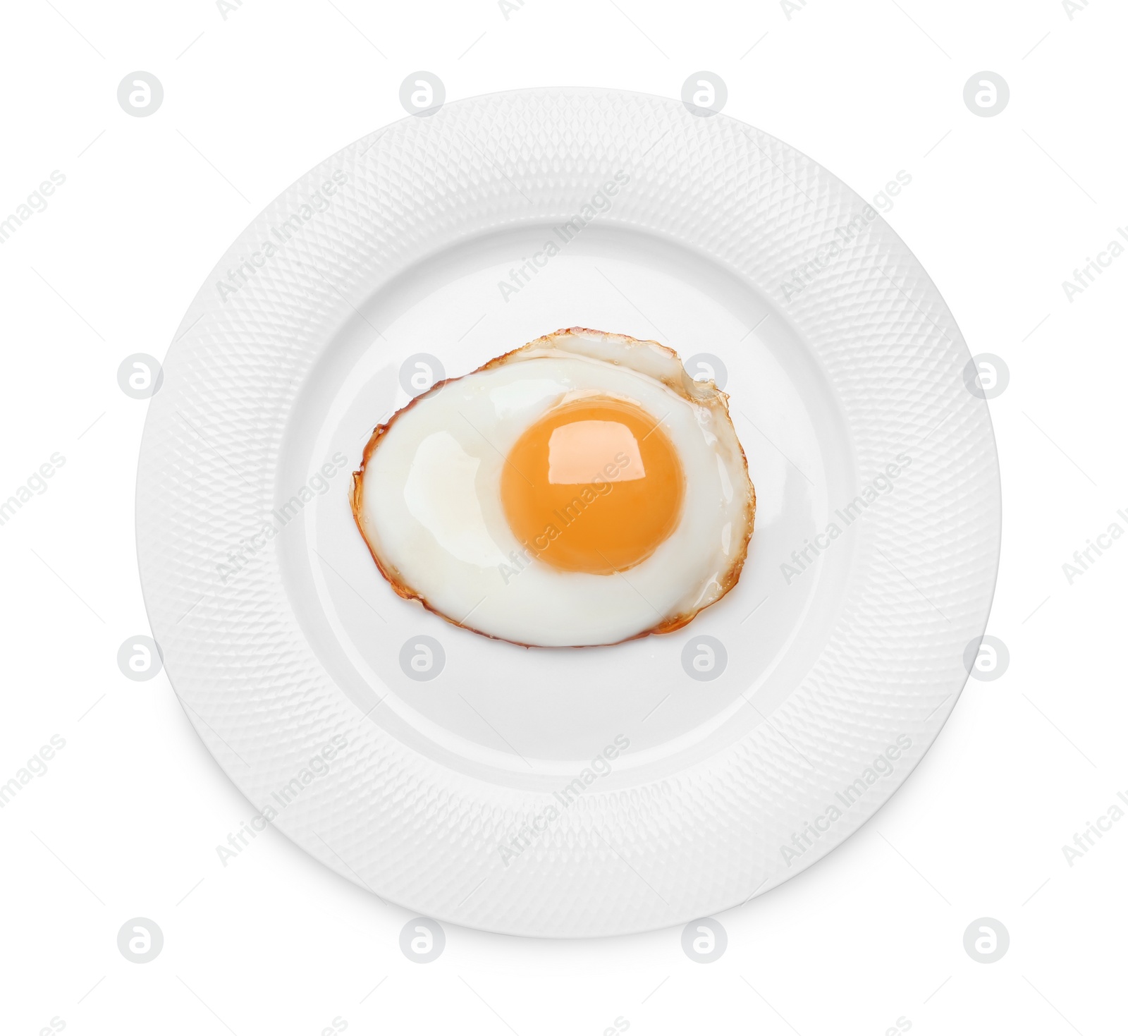 Photo of Plate with delicious fried egg isolated on white, top view