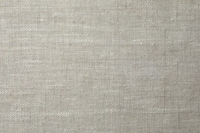 Photo of Texture of light grey fabric as background, top view