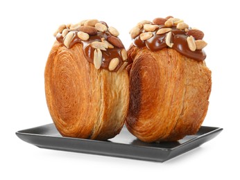 Photo of Round croissants with chocolate paste and nuts isolated on white. Tasty puff pastry