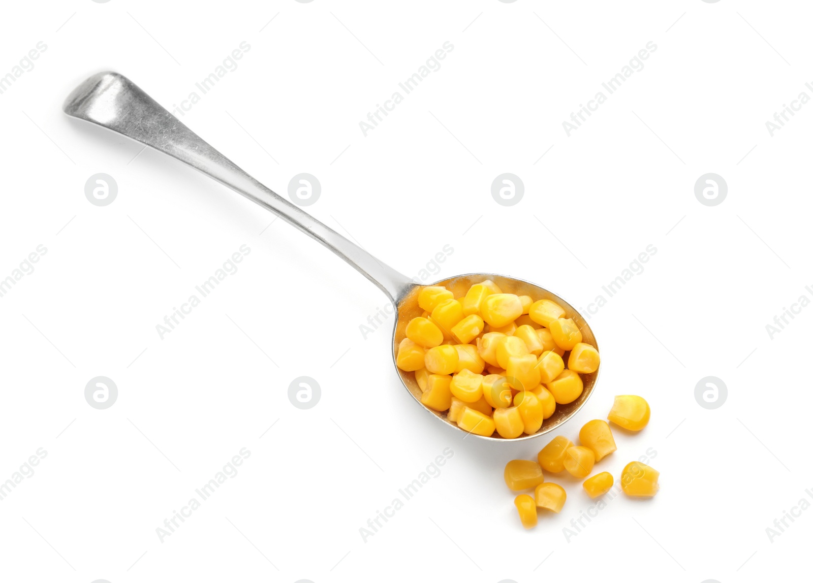 Photo of Spoon with corn kernels on white background