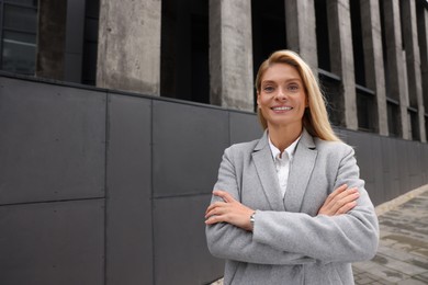 Photo of Portrait of smiling woman outdoors, space for text. Lawyer, businesswoman, accountant or manager