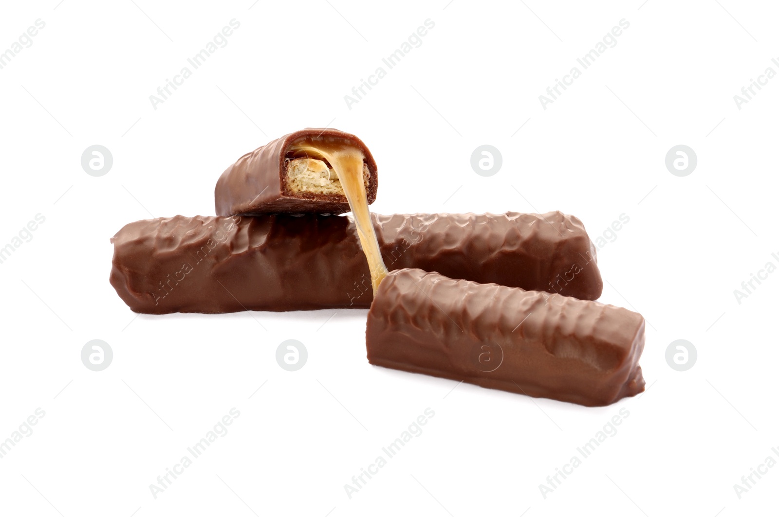 Photo of Sweet tasty chocolate bars with caramel on white background