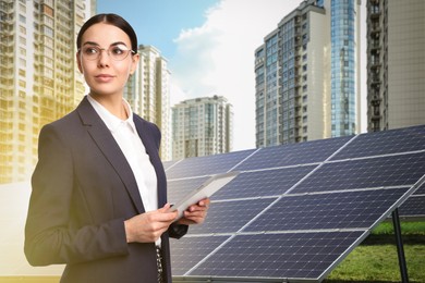 Image of Young businesswoman with tablet near solar panels and beautiful view of cityscape. Alternative energy source