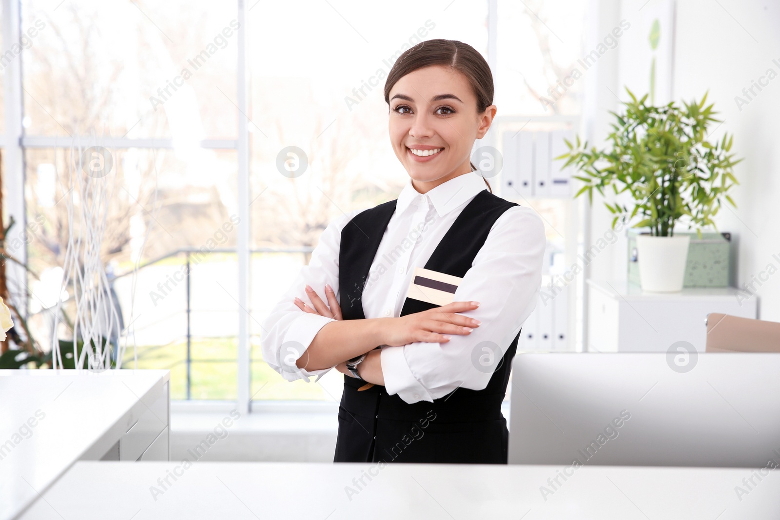 Photo of Portrait of female receptionist at workplace in hotel