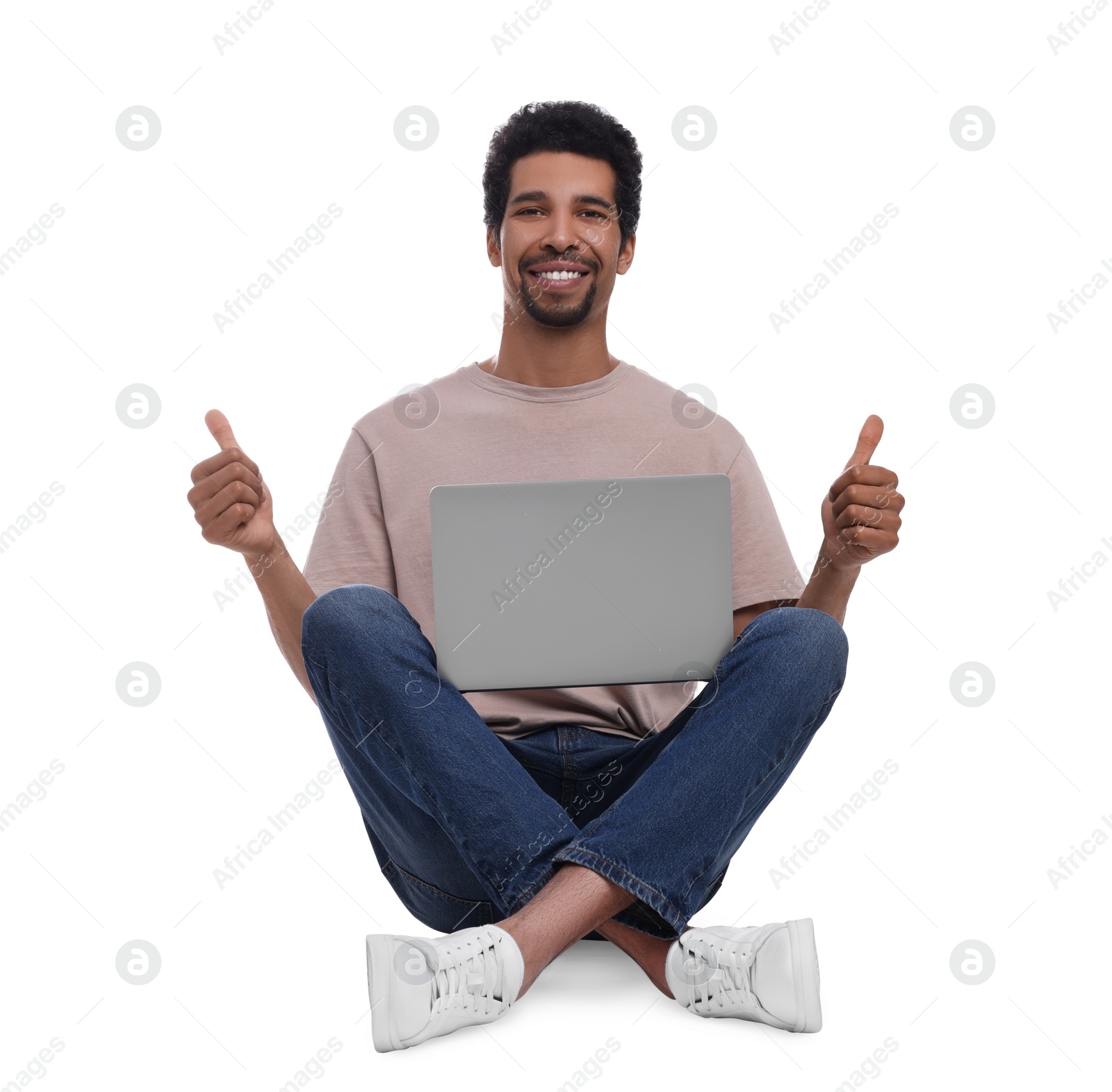 Photo of Happy man with laptop showing thumbs up on white background