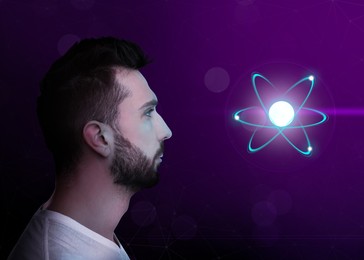 Image of Man and virtual model of atom on color background