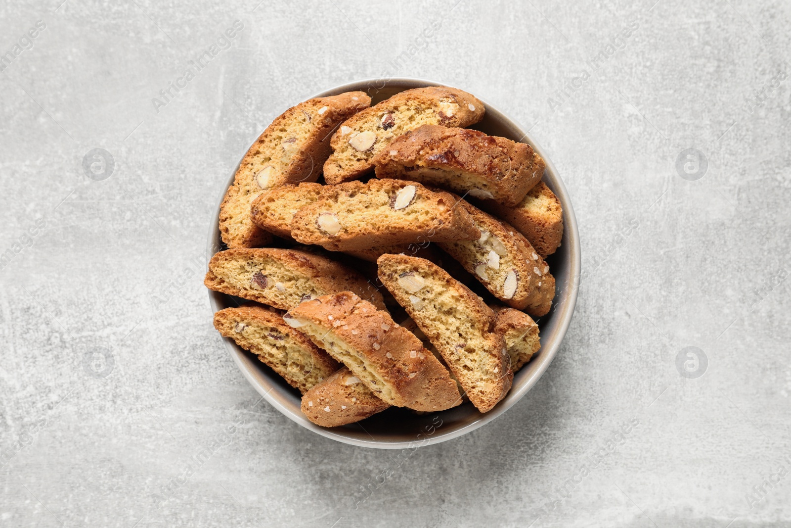 Photo of Traditional Italian almond biscuits (Cantucci) on light table, top view