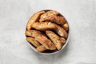 Photo of Traditional Italian almond biscuits (Cantucci) on light table, top view