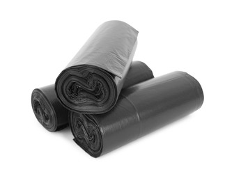 Photo of Rolls of black garbage bags isolated on white