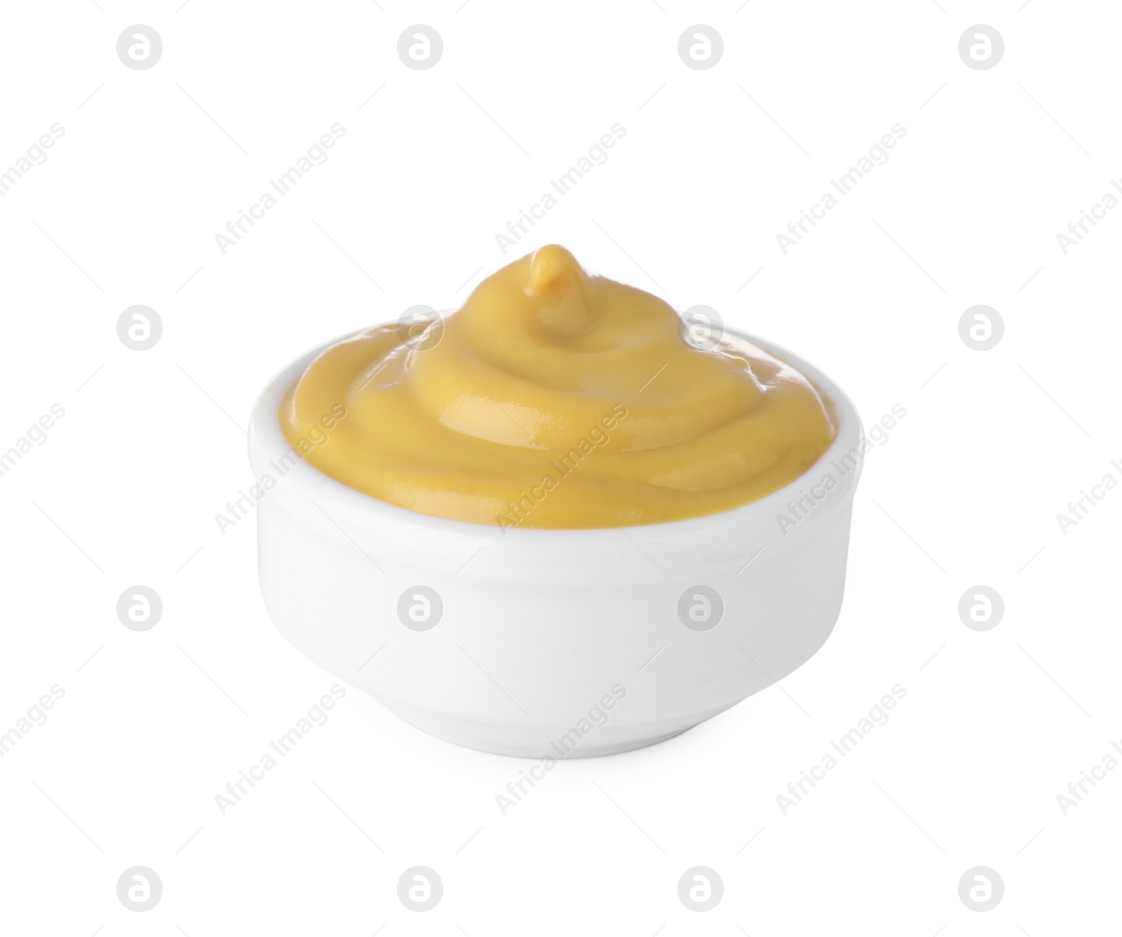 Photo of Bowl with delicious mustard isolated on white