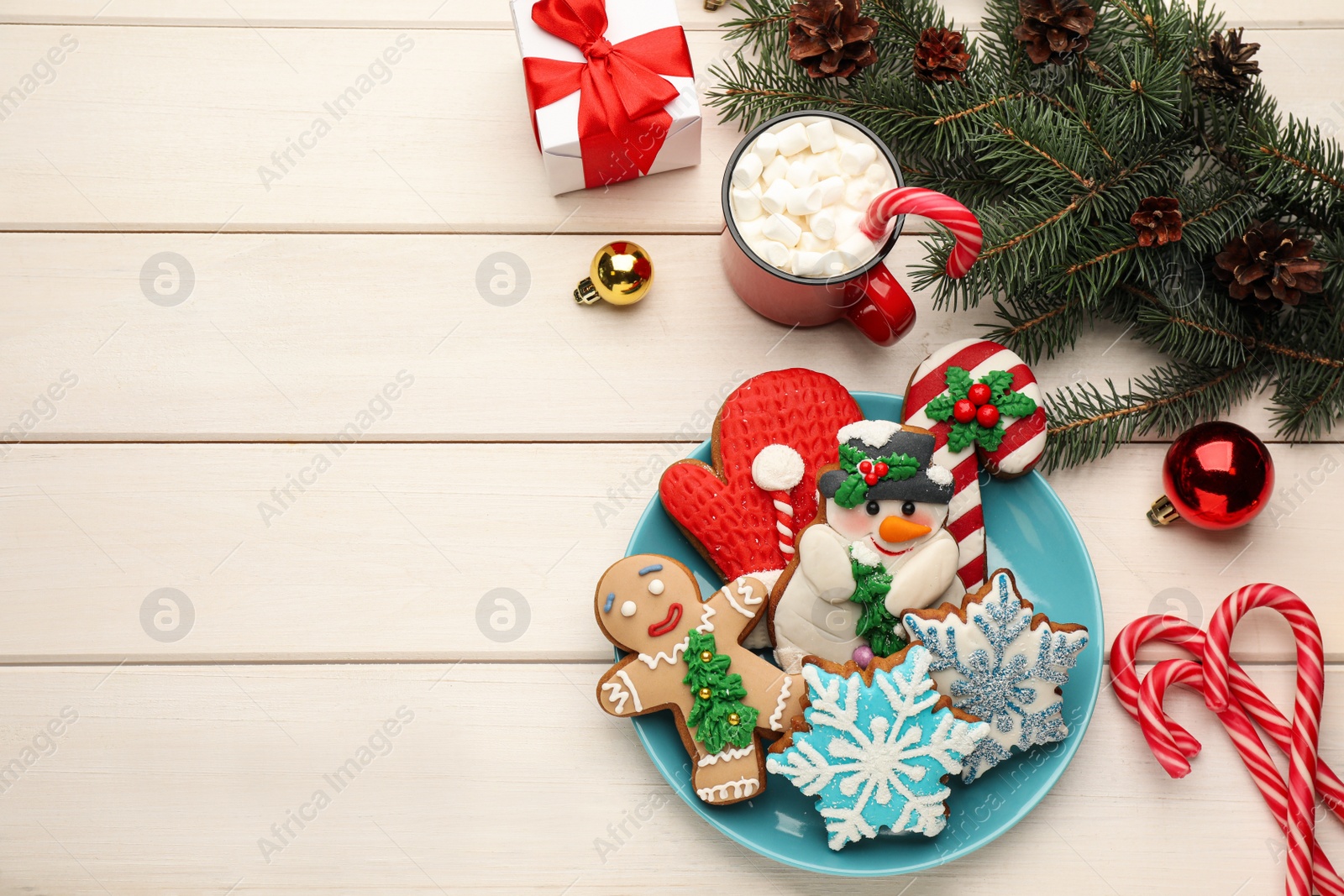 Photo of Delicious homemade Christmas cookies, cocoa and festive decor on white wooden table, flat lay. Space for text
