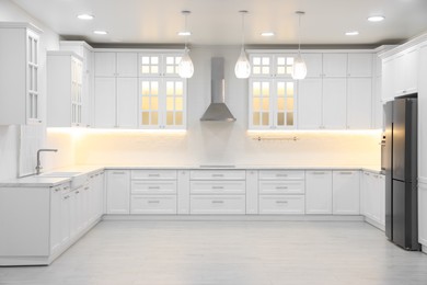 Modern light kitchen interior with stylish furniture