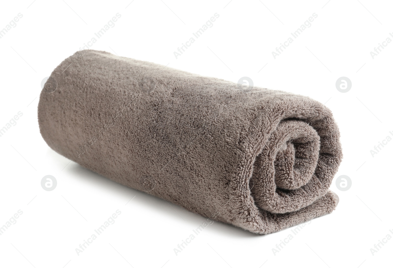 Photo of Rolled soft terry towel on white background