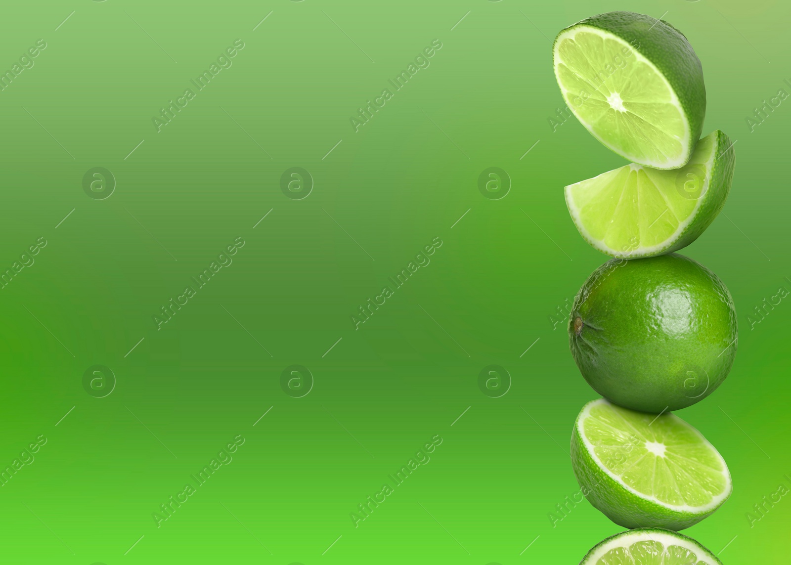 Image of Stacked whole and cut limes on green background, space for text