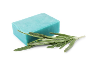 Soap bar and rosemary on white background