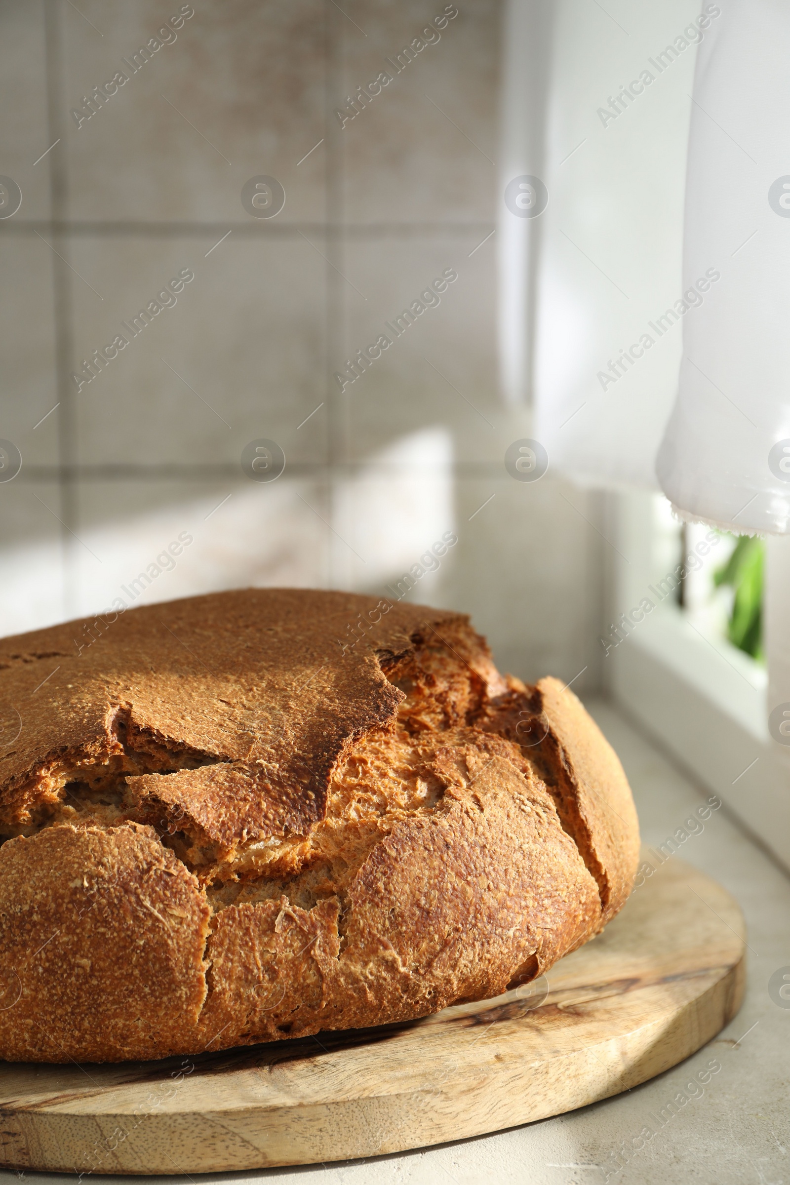 Photo of Freshly baked sourdough bread on light table