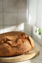 Photo of Freshly baked sourdough bread on light table