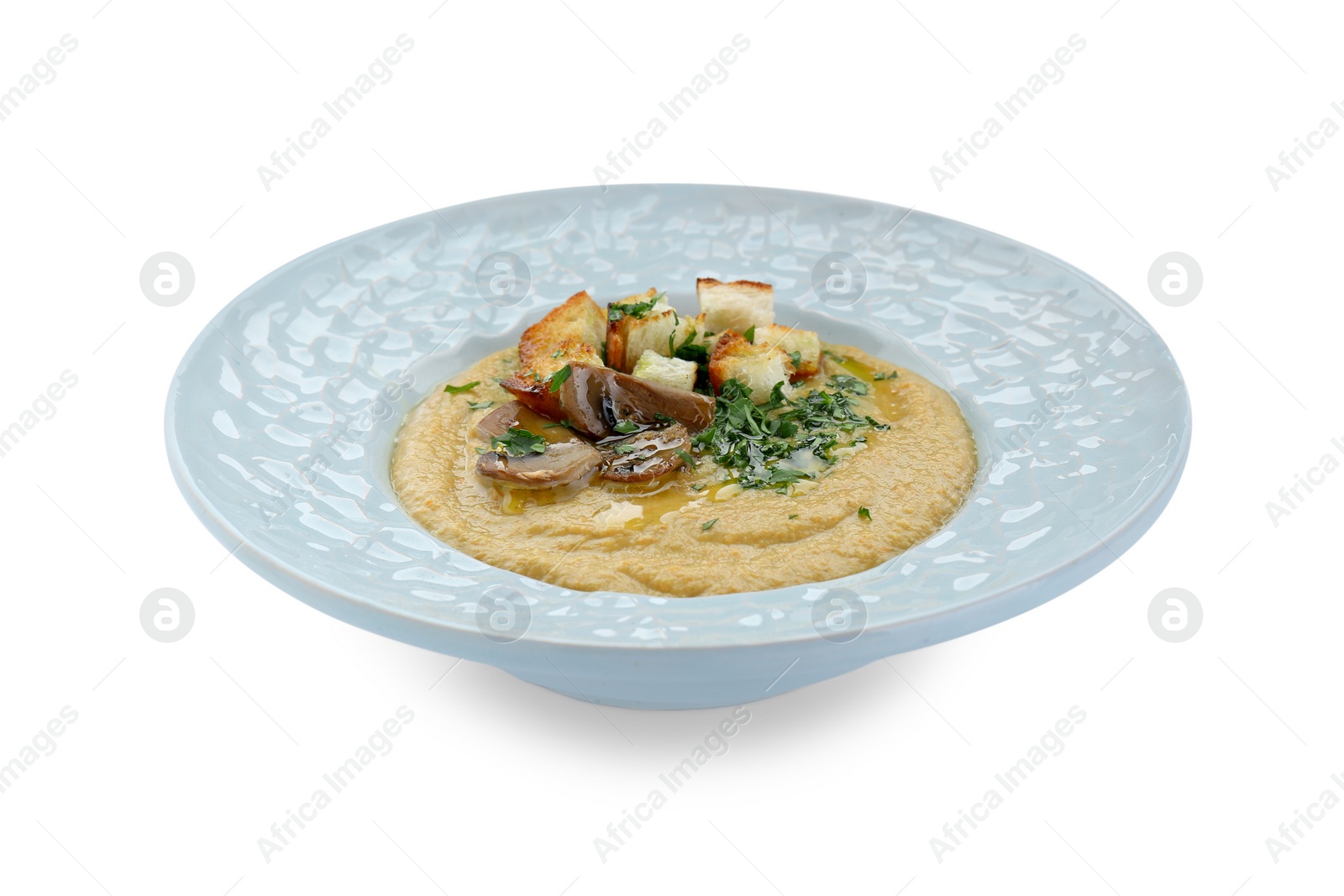 Photo of Delicious cream soup with mushrooms and croutons on white background