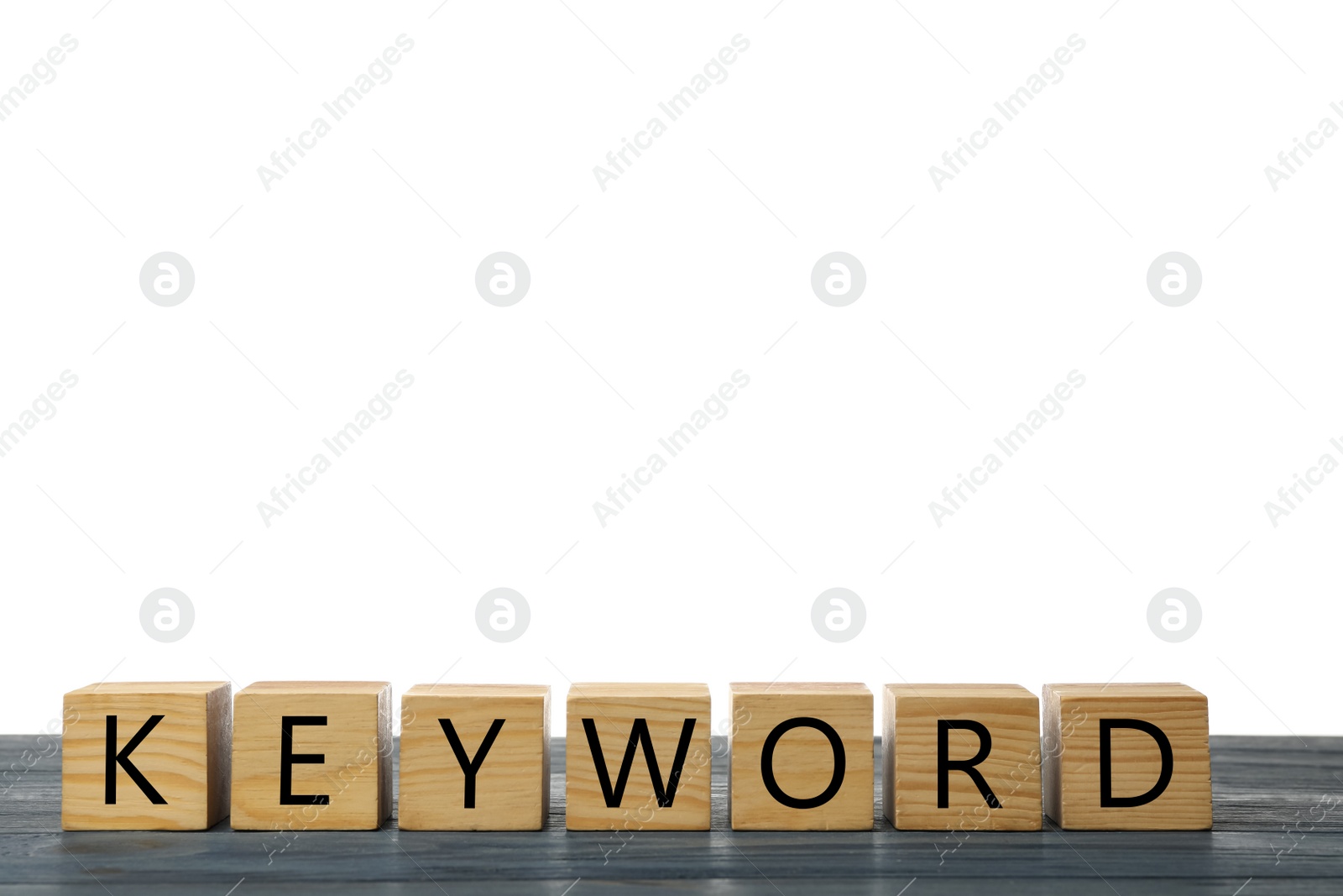 Photo of Cubes with word KEYWORD on grey wooden table