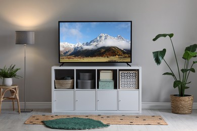 Mountain landscape on TV screen in room