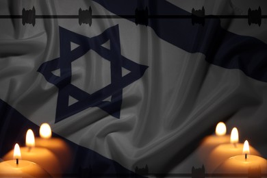 Image of Holocaust memory day. Flag of Israel and burning candles, double exposure