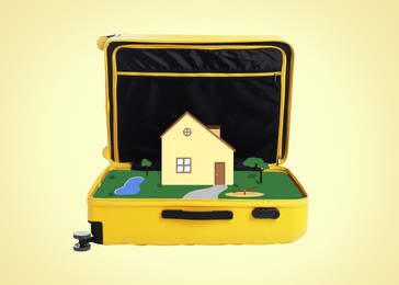 Image of Illustration of house and courtyard inside of open suitcase on beige background