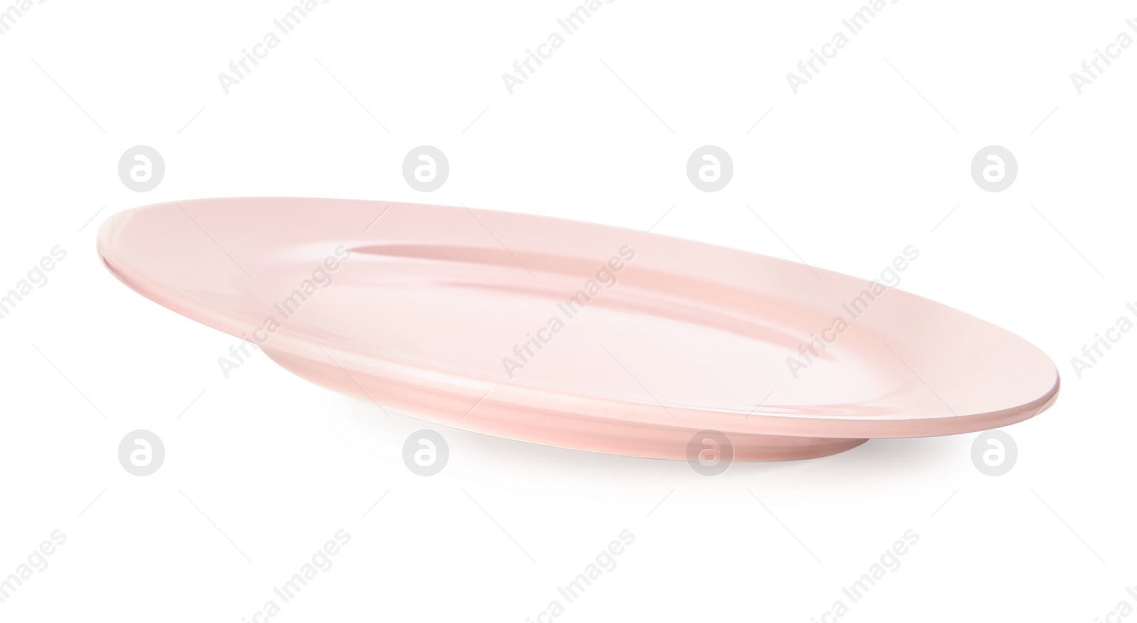 Photo of Clean light pink plate isolated on white