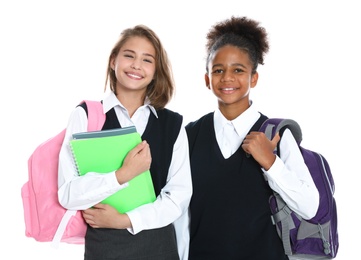 Happy girls in school uniform on white background