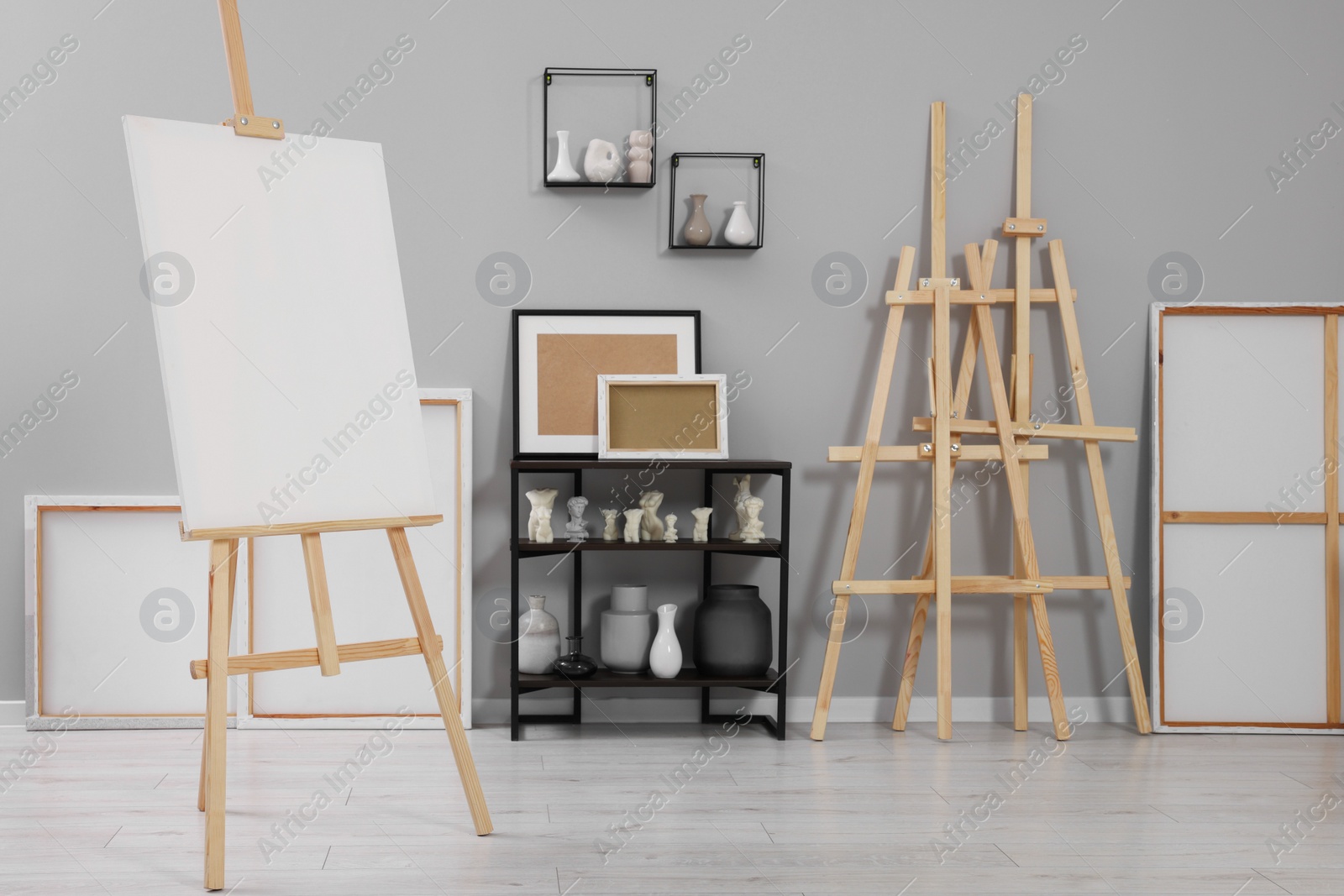 Photo of Artist's studio with easels, canvases and painting supplies