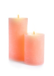 Two decorative pink wax candles on white background