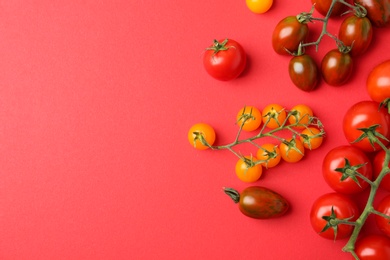 Photo of Flat lay composition with fresh ripe tomatoes on red background. Space for text