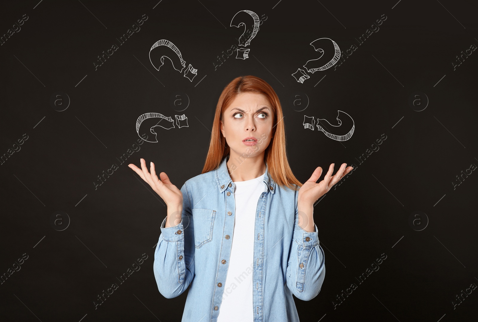Image of Choice in profession or other areas of life, concept. Making decision, thoughtful woman surrounded by drawn question marks on black background