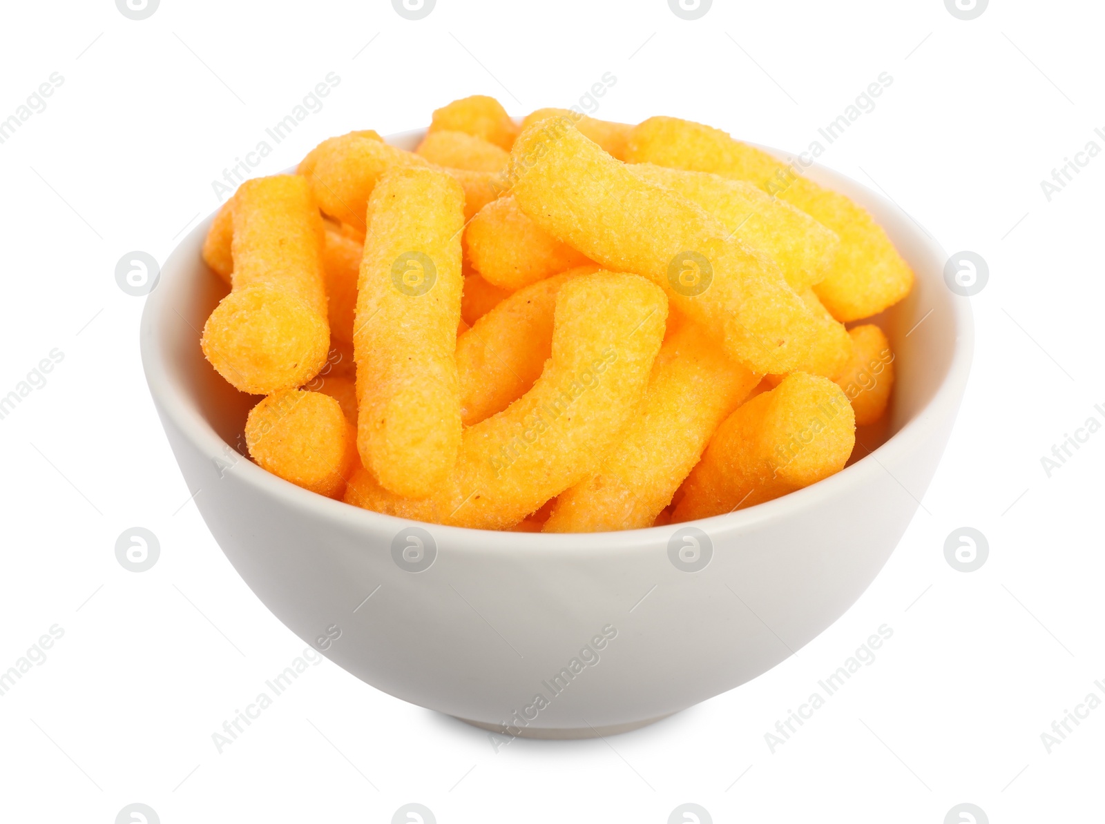 Photo of Many tasty cheesy corn puffs in bowl isolated on white
