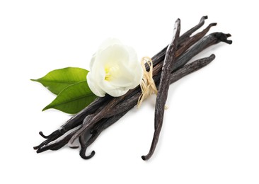 Photo of Vanilla pods, green leaves and flower isolated on white