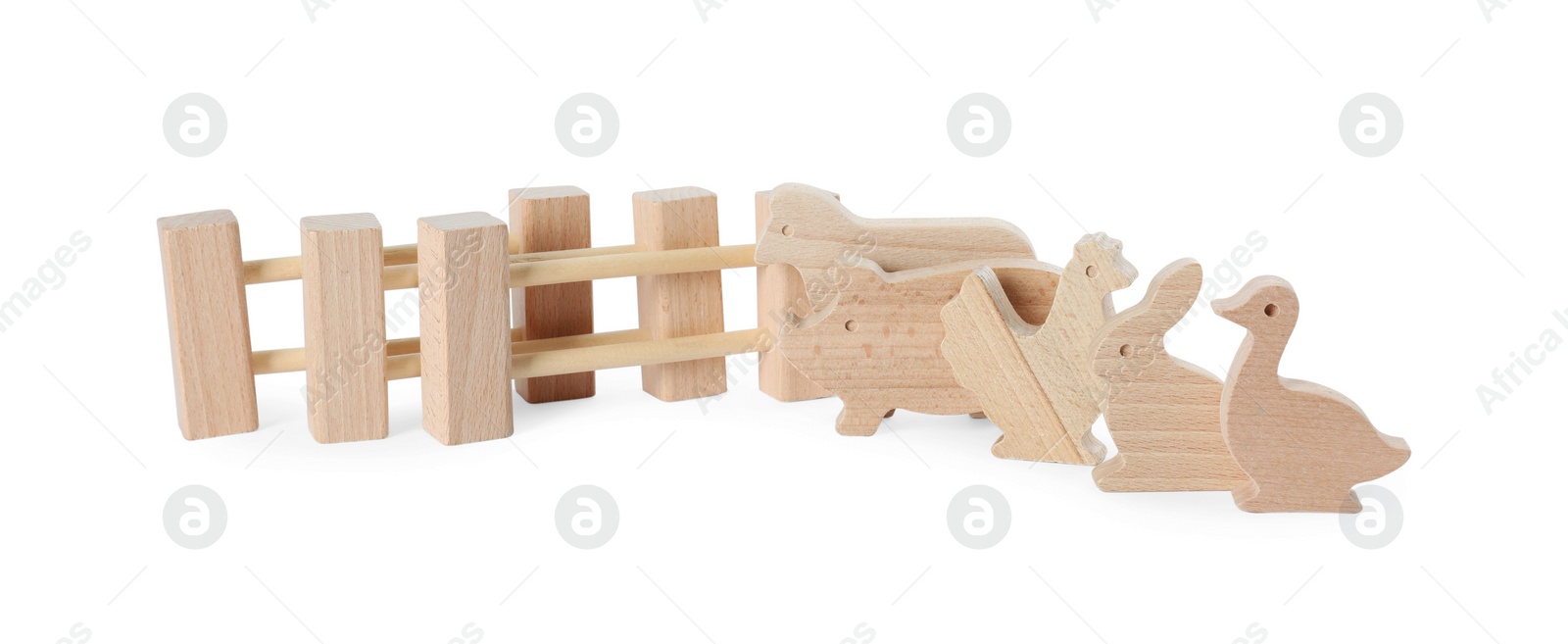 Photo of Wooden animals and fence isolated on white. Children's toy