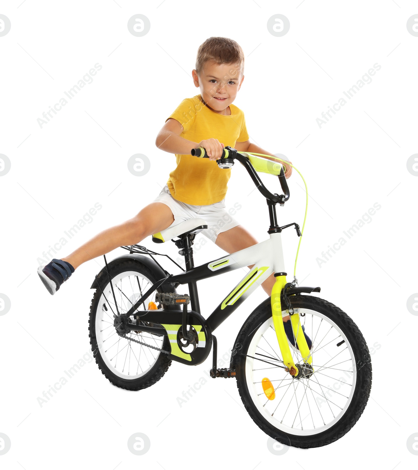 Photo of Cute little boy riding bicycle on white background