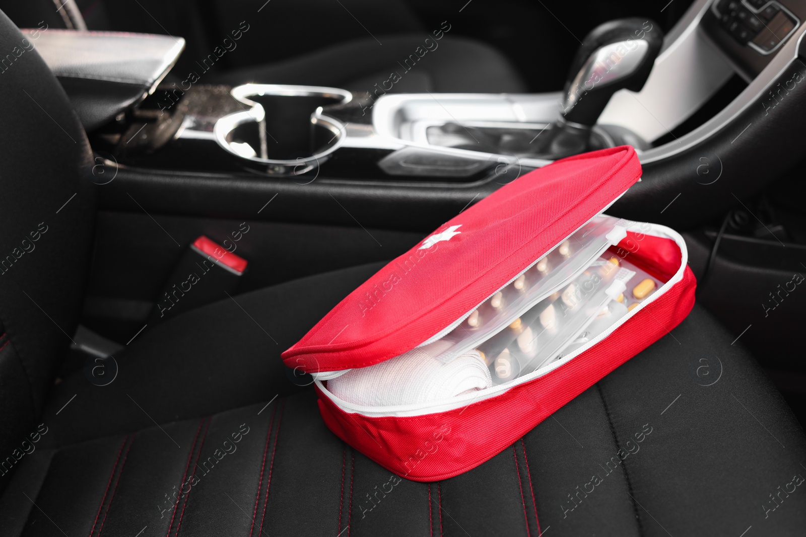 Photo of First aid kit with medicaments inside car