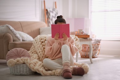 Photo of Woman with book relaxing at home. Cozy atmosphere