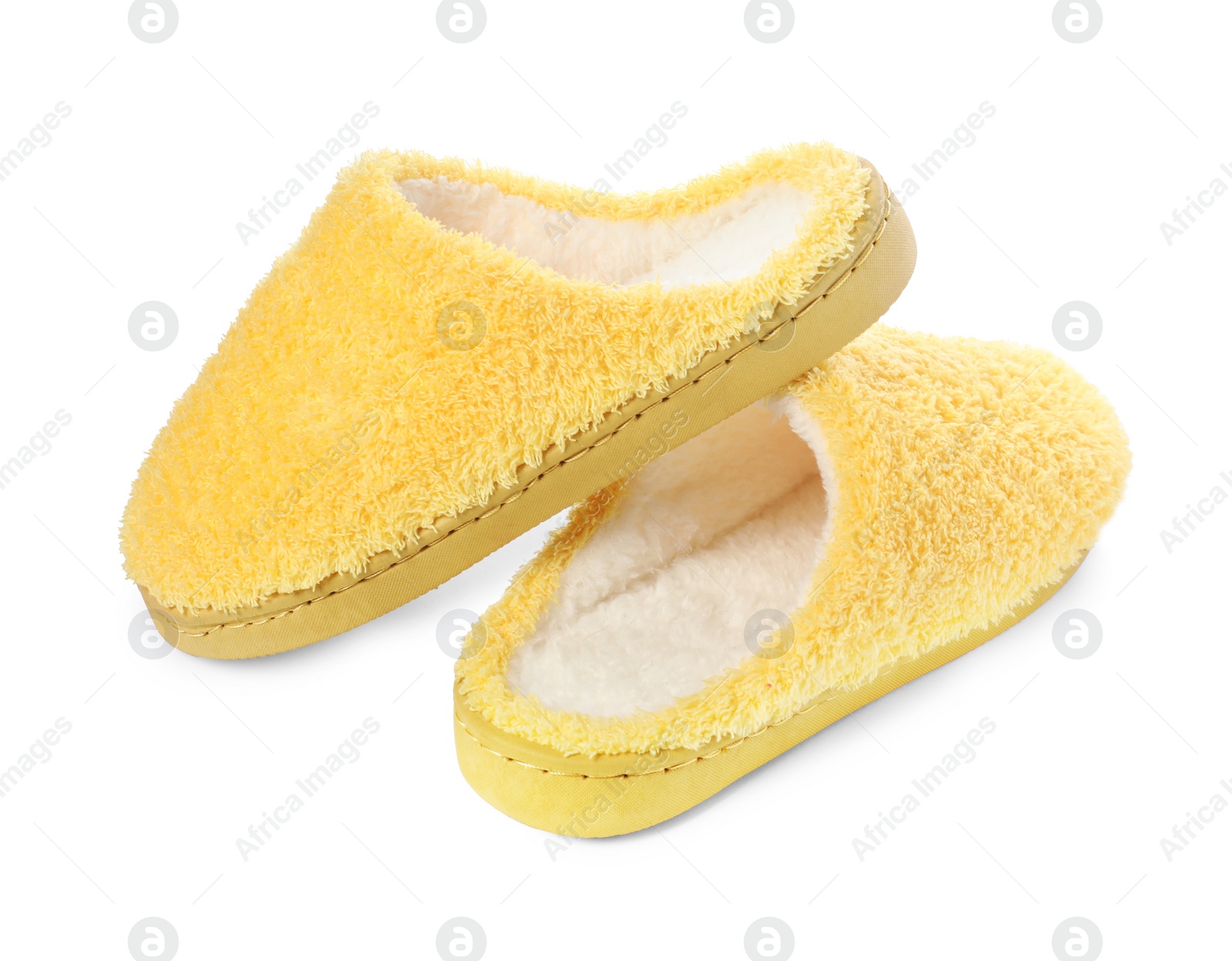 Photo of Pair of yellow soft slippers isolated on white